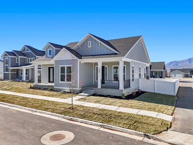 Modern farmhouse style home with roof with shingles, a porch, board and batten siding, and a mountain view