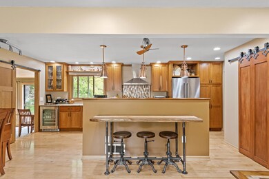 Breakfast Bar is not attached and does not stay with home.  Made by seller, though he may consider selling it.