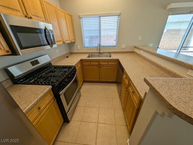 Kitchen featuring appliances with stainless steel