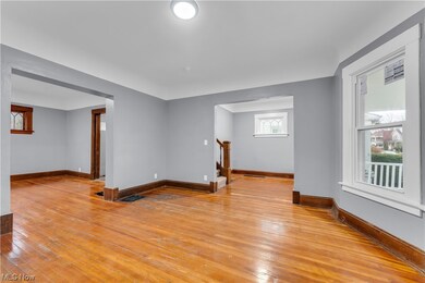 Empty room featuring light hardwood / wood-style flooring and plenty of natural light