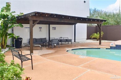 Community pool featuring a patio