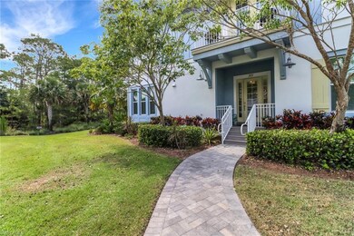 View of front of house with a front yard and stucco siding