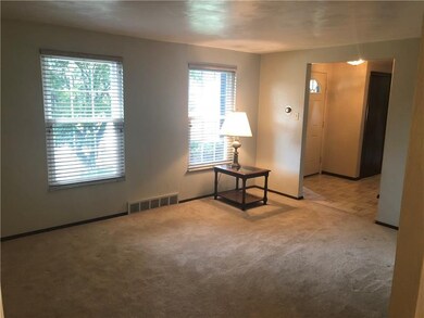 Living room from dining room looking out to entry
