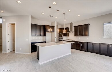 Kitchen has Quartz Backsplash