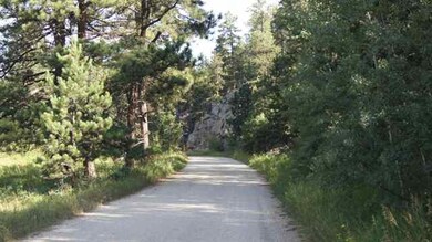 View down road of rock formations