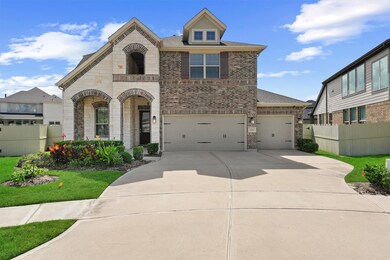 This charming two-story home features a brick and