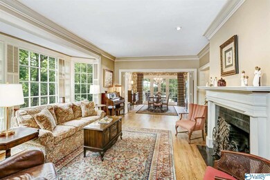 This upstairs family room has a fireplace and a large bay window that gives a birds eye view to the backyard and lets in lots of light.  This is a great cozy space that is great for family gatherings.