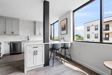 Kitchen with stainless steel dishwasher, light co