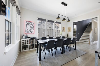 Huge eat-in kitchen surrounded by windows.