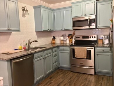 Subway tile, Granite Counter tops, Tile flooring, and the appliances all stay!
