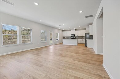 Unfurnished living room featuring recessed lighting and light wood-style flooring