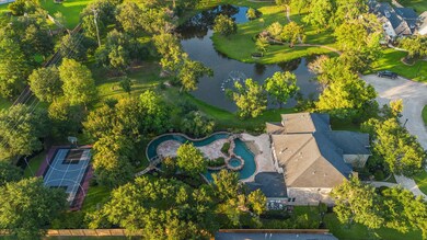Location is EVERYTHING! Nestled among the trees, the private backyard opens to the neighborhood pond with fountain adding to the relaxing atmosphere.
