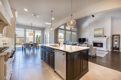 Gas cooktop, pot drawers and stunning light fixtur