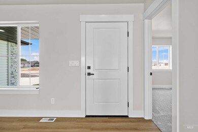 Entrance foyer featuring plenty of natural light and light wood-type flooring