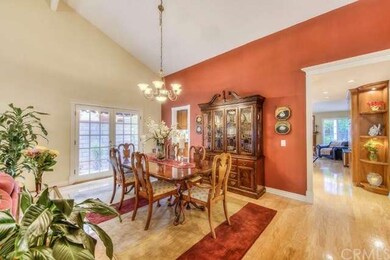 Formal dining room has added French doors and noti