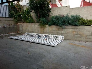 Parking space accommodates three cars.