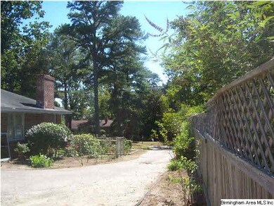 View of driveway from back parking area to street.