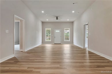 Foyer featuring a ceiling fan, recessed lighting, and light wood-style flooring