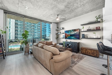 Showcasing expansive floor-to-ceiling windows that