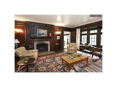 Living room has rich paneling and detail. Lots of 