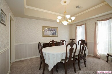 This formal dining room is large enough for a big table and serving or storage pieces.