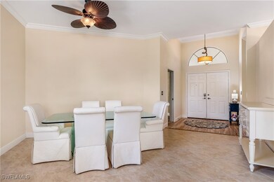 Dining room featuring crown molding, ceiling fan