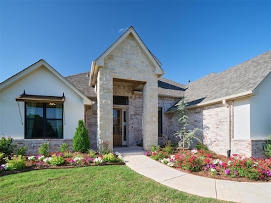 View of front of house with roof with shingles, a front yard, stucco siding, and stone siding