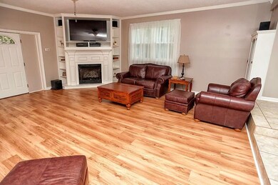 Fantastic gas log corner fireplace makes this room the perfect place to relax.