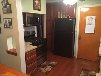 Kitchen features newer appliances- range, refrigerator, dishwasher. Laminate floor installed 2012. Plenty of cabinet space.