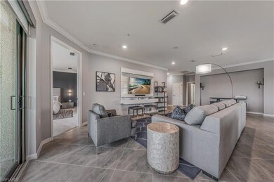 Tiled living room with crown molding