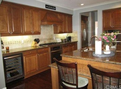 The upgraded kitchen has granite countertops, tumb