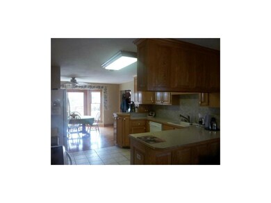 Tons of cabinets in this great kitchen!  Has a bar