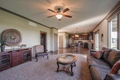 Great room w/ view of the open kitchen.