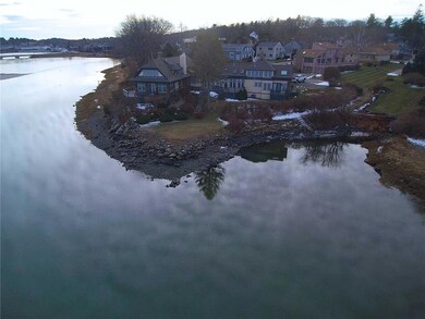 The water side of the building sits...