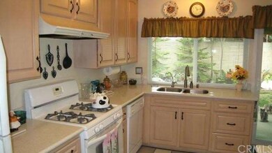Light and bright kitchen with newer cabinets, coun