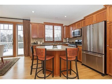 Eat-in kitchen features cherry cabinets, millwork,