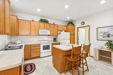 Kitchen features a center island, and well maintained appliances