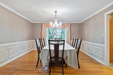 Dining Room features gleaming hardwood floors & ex
