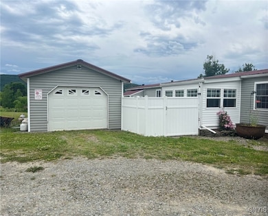 home with garage and fenced in patio