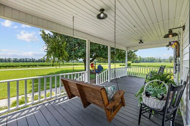 Wooden deck featuring a lawn