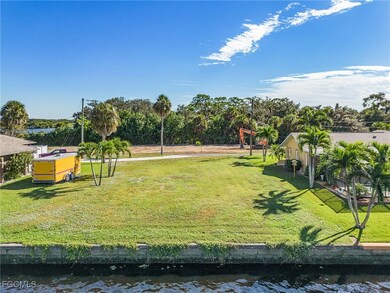 View of home's community with a water view and a yard