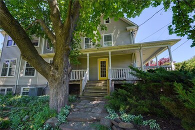 South side stairs to porch, large basement windows