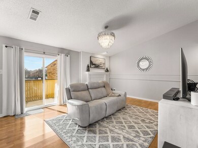 Living room with hardwood / wood-style floors, a n
