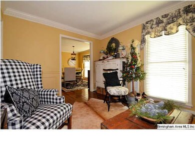 Beyond the formal dining room is cozy, warm den.  