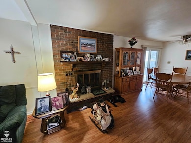 View of Masonary Fireplace with Gas Fired logs.