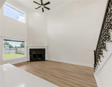 Unfurnished living room with light wood-style floo
