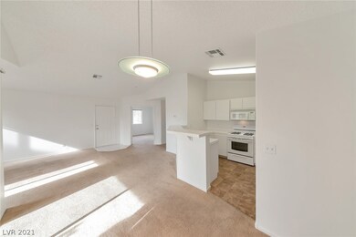 View from Dining Area, showing Living Rm, Den & Ki