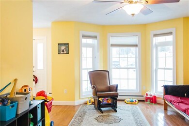 The den has large windows that allow...