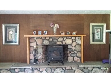Natural river rock, full masonry fireplace with ra