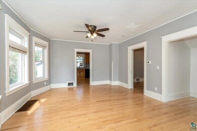 Spare room featuring ornamental molding, ceiling f